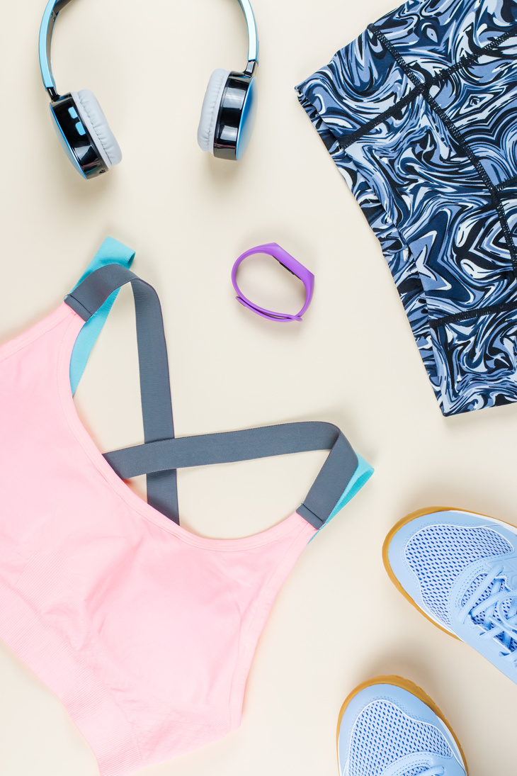 Feminine Fitness Clothing and Accessories on Yellow Background